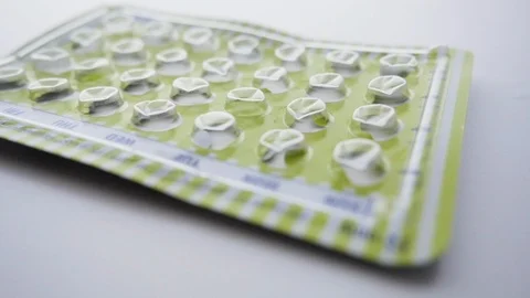 Empty Package of Birth Control Pills Drops Stock Footage 112527737