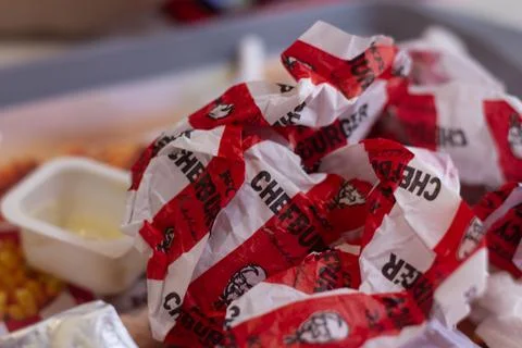 Empty packaging from order, burger, french fries, ketchup, garbage after lunch Stock Photos