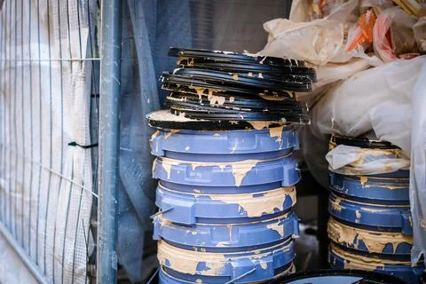Empty paint buckets, construction waste, construction. Selective focus Stock Photos