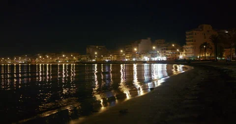 Empty Palma de Mallorca Beach at Night with City Lights and Gentle Waves Stock Footage 343591819