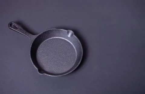 Empty pan for cooking on dark table, top view Stock Photos