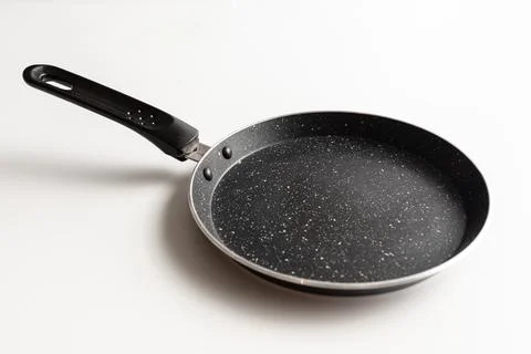 Empty pan for pancake on white background Stock Photos