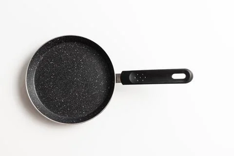 Empty pan on white background. Fried pan with spatula Stock Photos