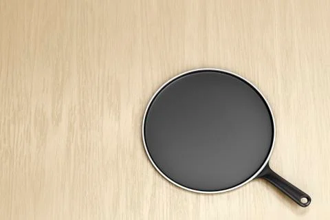 Empty pancake pan on table Illustrazione stock
