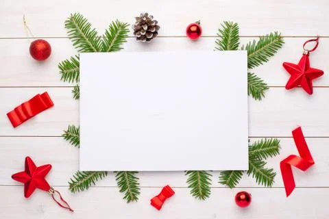 Empty paper for greeting text or logo surrounded with Christmas fir branches  Stock Photos