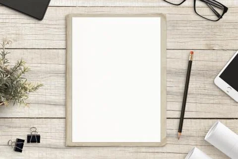 Empty paper mockup, on old folder, white wooden work desk. Top view, flat lay. Foto stock