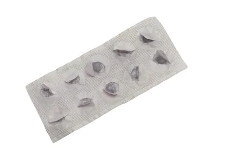 Empty paper plate of tablets of activated charcoal. Isolated Stock Photos