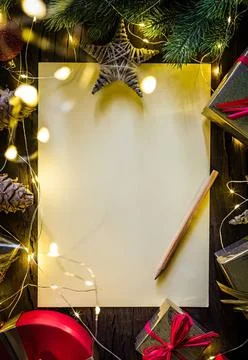 Empty paper sheet with christmas decorations and lights Stock Photos