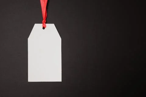 Empty paper tag on black background Stock Photos