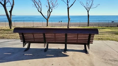 Empty Park Bench Facing The Blue Sea Stock-Footage 342653404