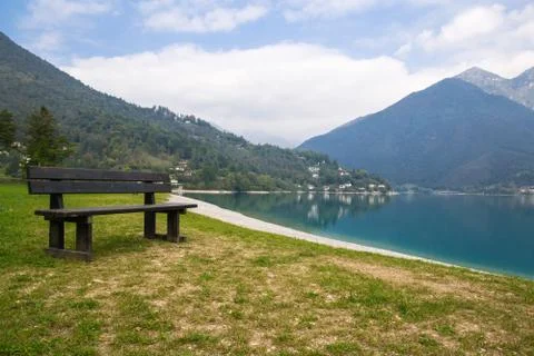 Empty park bench on the lake Stock Photos