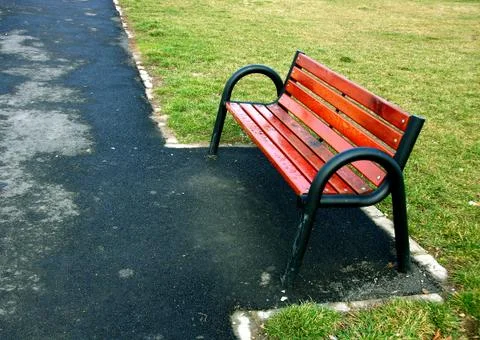 Empty park bench Stock Photos