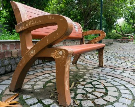 An empty park bench. Stock Photos