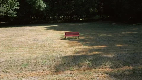 Empty Park Bench In Summer - Drone Pullback Stock Footage 318651398