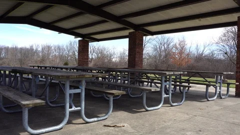 Empty park benches tables on a spring fall day, 4k, pan shot. Stock Footage 115272598