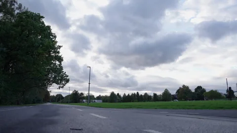 Empty Park Road Beneath Dramatic Cloudy Sky Stock Footage 347813735