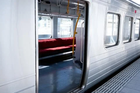 Empty parked train with seats on the side POV from outside Stock Photos