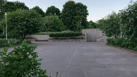 Empty parking lot surrounded by green trees Stock Footage 91119644