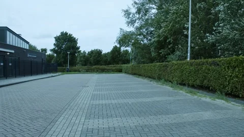 Empty Parking Lot Surrounded By Trees Video stock 247142721