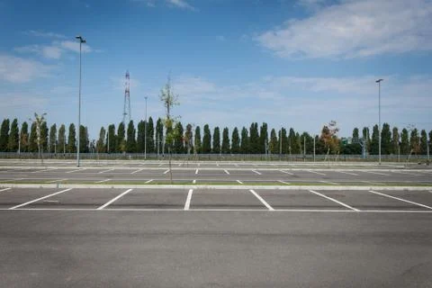 Empty parking lot with trees Stock Photos