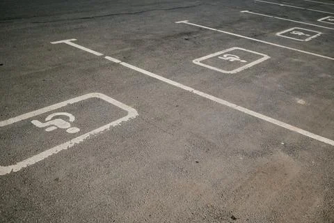 Empty Parking Spaces with Disabled Markings Visible Stock Photos