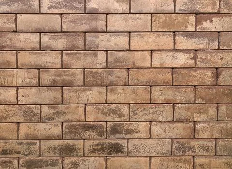 Empty part of natural brown brick wall. Stock Photos