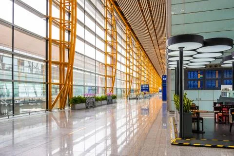 Empty passage with large windows at Beijing International Airport Stock Photos