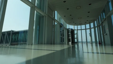 Empty passage to passenger boarding bridge at modern airport Stock Footage 126939993