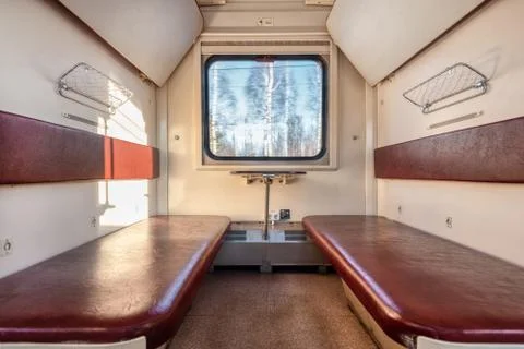Empty passenger compartment in a moving train. Stock Photos