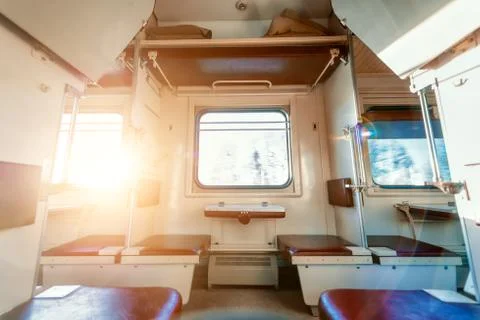 Empty passenger compartment in a moving train. Stock Photos