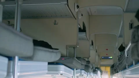 The empty passenger compartment of the second class carriage. Bunk beds with Stock Footage 150075559