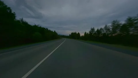 An empty paved road at dusk. Beautiful, soothing nature. Field and forest. Trip Stock Footage 158076831