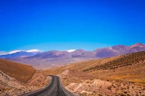 Empty paved road through Nevado Sajama National Park Stock Photos
