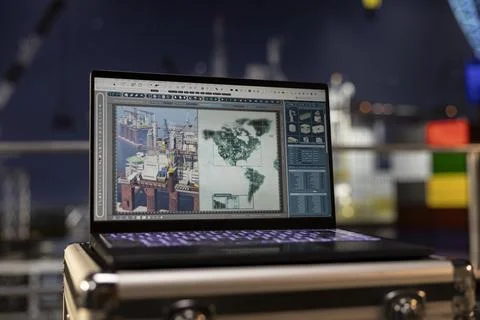 Empty pc displays predictive maintenance dashboard on offshore drilling rig Stock Photos