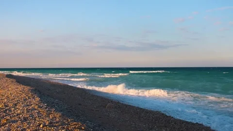 Empty Pebble Beach on the Coast of Oman with Turquoise Waves Stock Footage 318824152