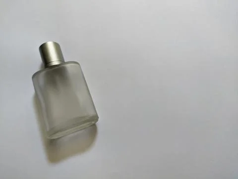 Empty perfume bottle on white background Stock Photos