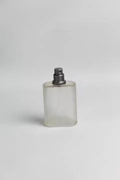 Empty perfume bottle on white background Foto stock