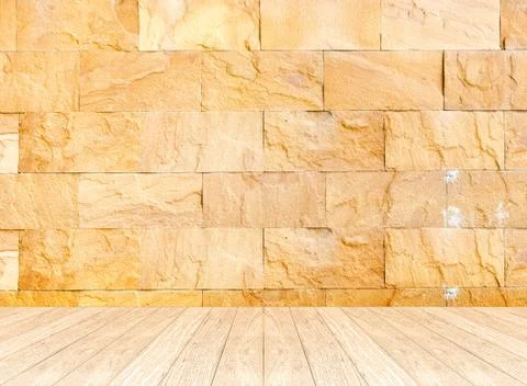 Empty perspective room with sand stone wall and wooden plank floor,Template.. Stock Photos