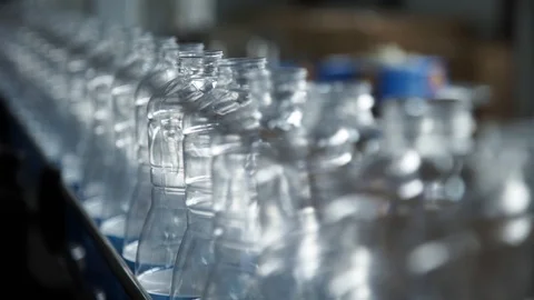 Empty PET bottles moving along a conveyor belt Stock Footage 99206185