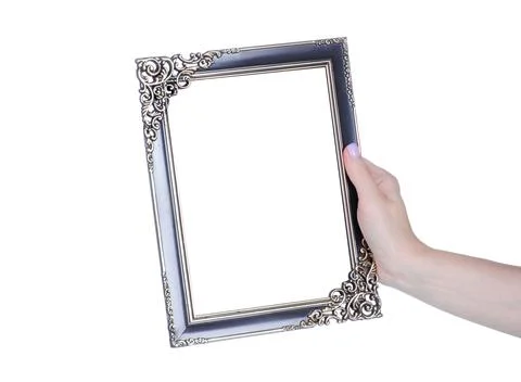Empty photo frame in hand Stock Photos