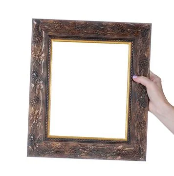 Empty photo frame in hand Stock Photos