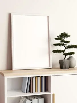 Empty photo frame leaning on wall and potted bonsai tree on wooden bookshel.. Ilustração Stock