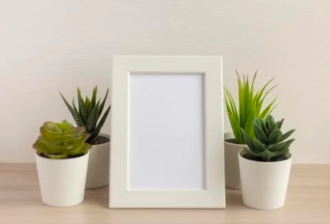 An empty photo frame on a table or shelf with a copy of the space Foto stock