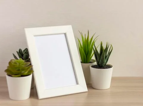 An empty photo frame on a table or shelf with a copy of the space Foto stock