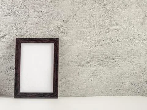 Empty photo frame on a table or shelf with a copy of the place Stock Photos