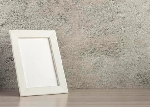 Empty photo frame on a table or shelf with a copy of the place Stock Photos