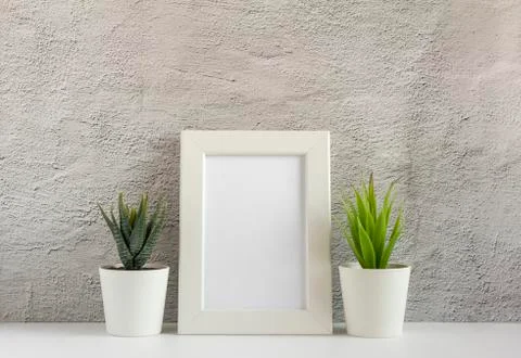 Empty photo frame on a table or shelf with a copy of the place Stock Photos