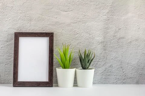 Empty photo frame on a table or shelf with a copy of the place Stock Photos