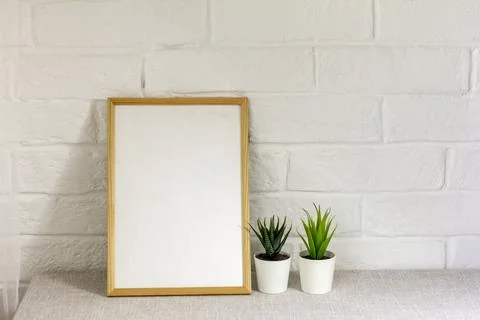 An empty photo frame on a table or shelf with a copy of the space. Stock Photos