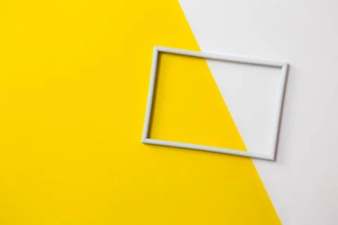 Empty photo frame for text on geometric paper background. Stock Photos
